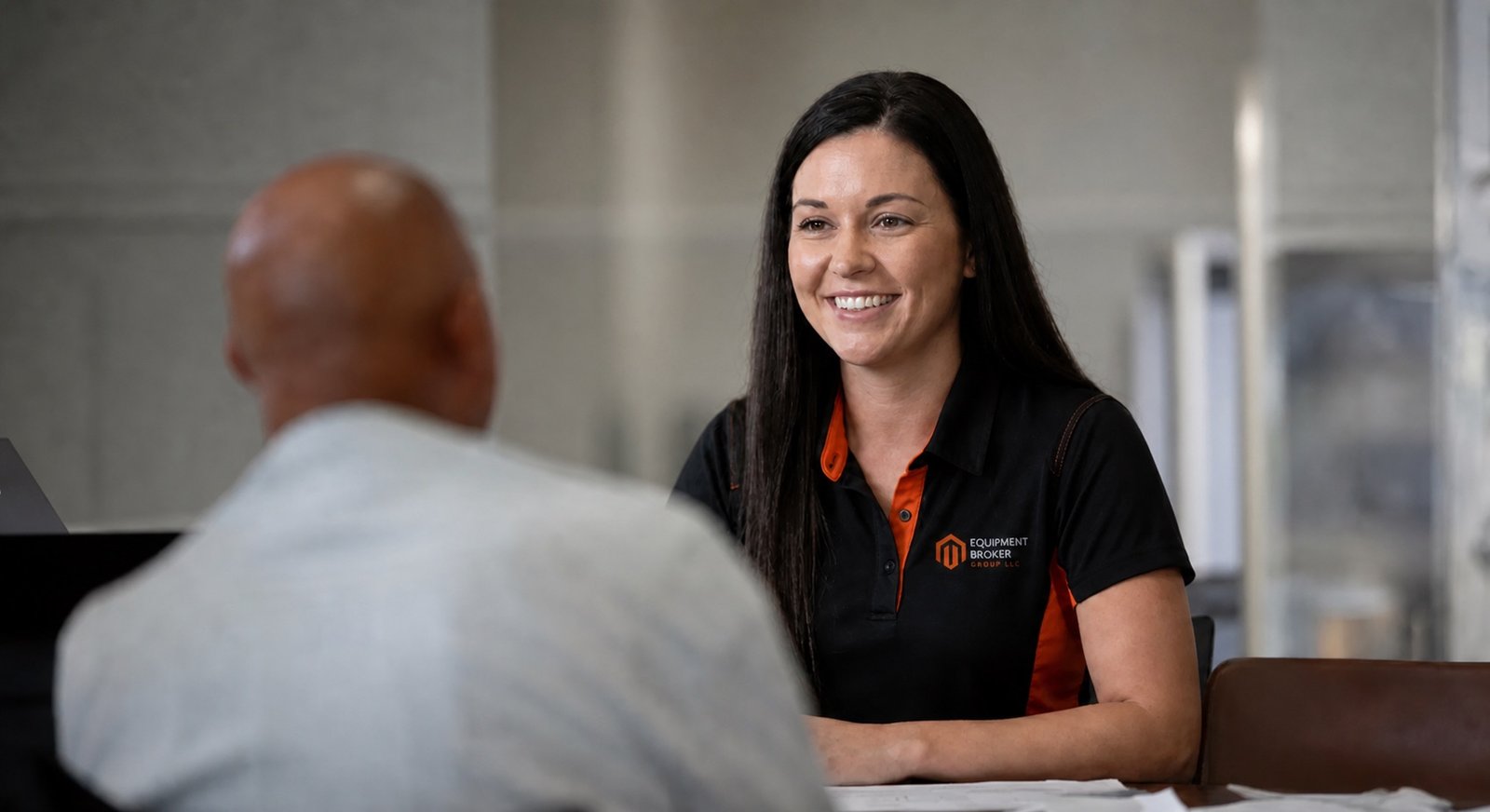 Equipment Broker Group customer support team member assisting a customer